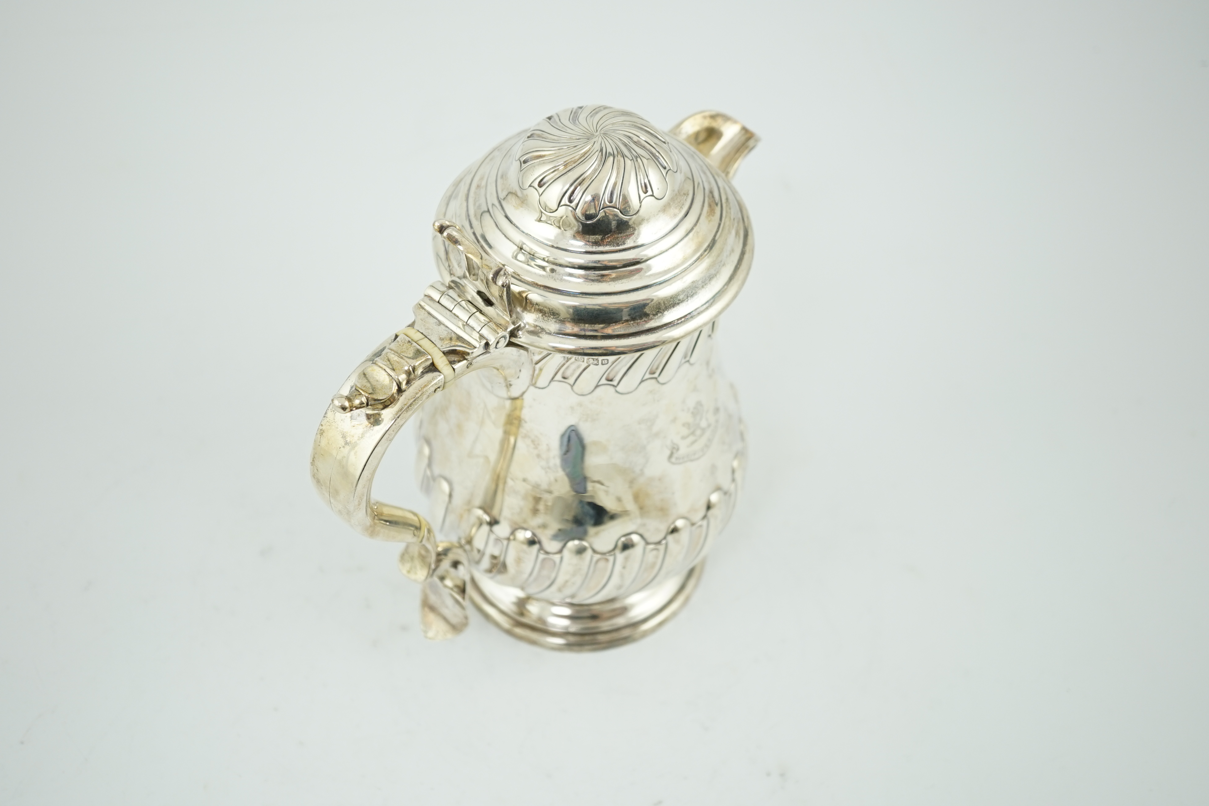 A late Victorian demi fluted wrythened silver hot water pot, by Thomas Bradbury & Sons, CITES Submission reference 8TFTTCSJ